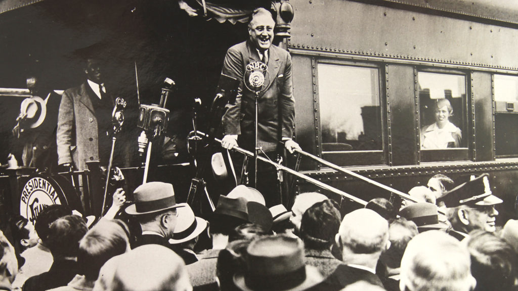 FDR addresses a crowd upon his return.